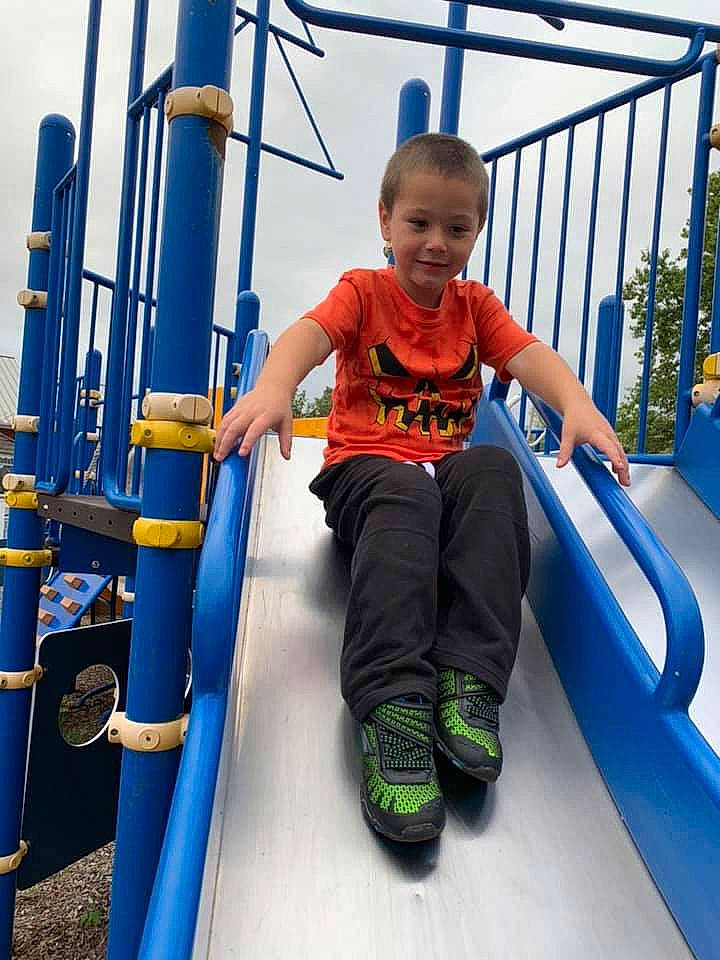 Justin joined the competition — help win amazing prizes! blue, child, city, fun, human_settlement, joy, leisure, outdoor_play_equipment, person, play, playground, playground_slide, public_space, recreation, smile, toddler