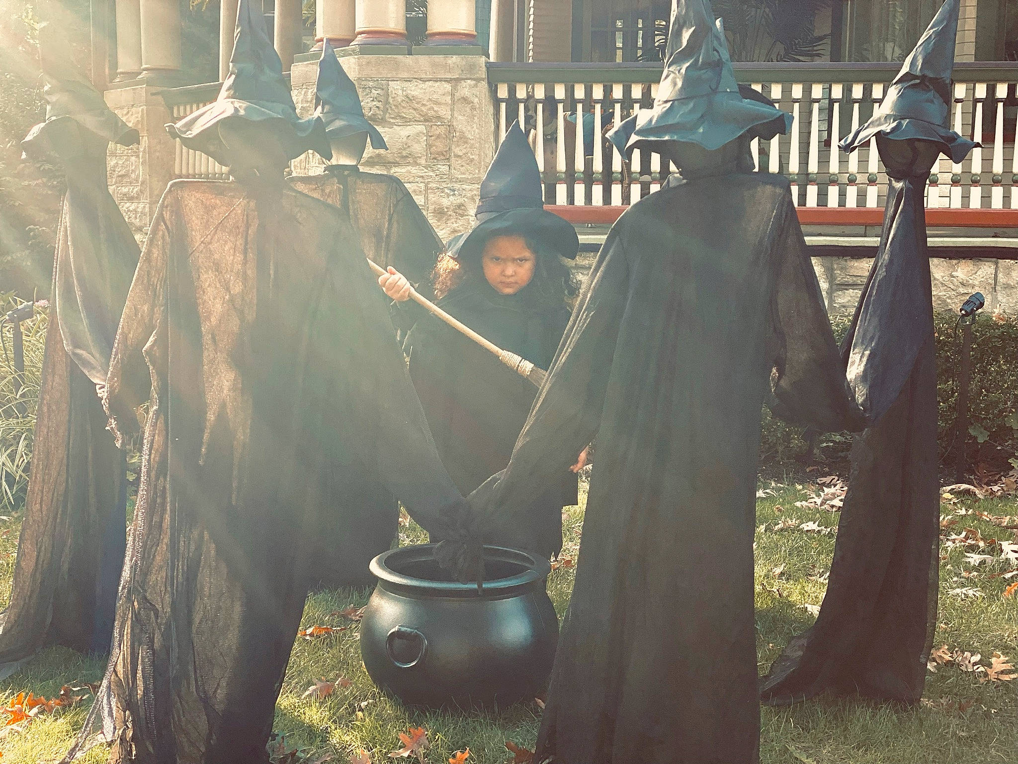 Emily is registered to the contest to win money with this photo: art, automotive_wheel_system, cookware_and_bakeware, event, fence, grass, hat, history, kettle, metal, person, personal_protective_equipment, plant, stock_photography, street, sun_hat, temple, tradition, visual_arts, window