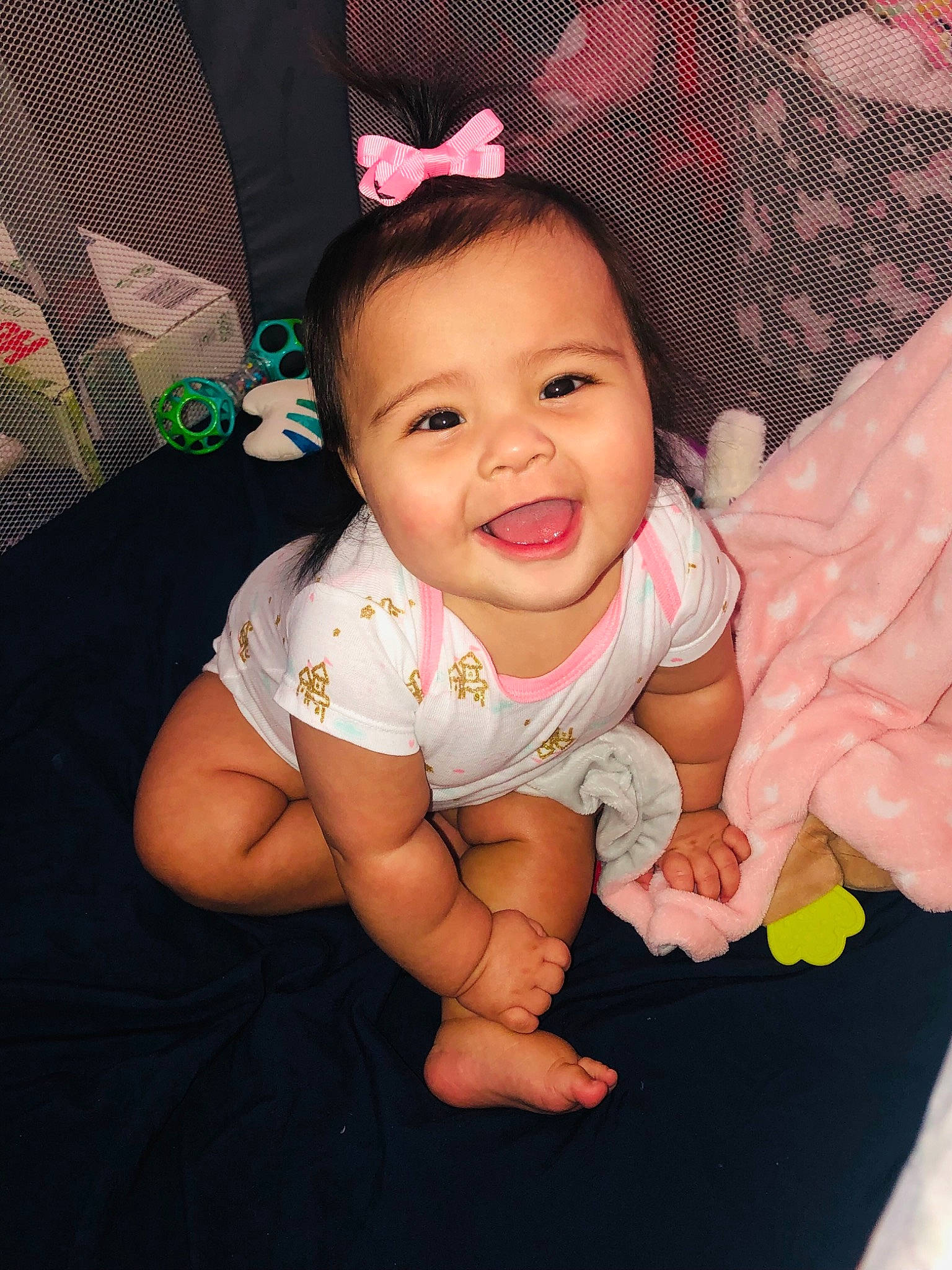 Abby is registered to the contest to win money with this photo: baby, baby_toddler_clothing, cheek, child, comfort, face, finger, flash_photography, fun, gesture, happy, human_leg, nail, person, pink, skin, sleeve, smile, t_shirt, thumb