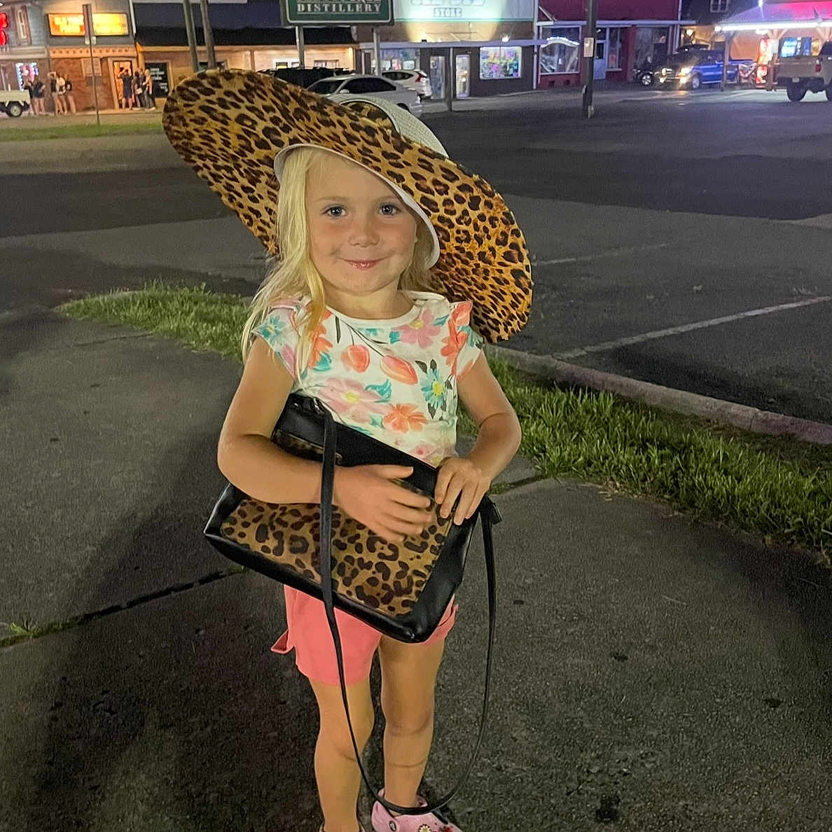 Abigail is registered to the contest to win money with this photo: accessories, bag, car, child, city, clothing, face, female, footwear, girl, handbag, hat, head, person, photography, portrait, road, shoe, street, urban