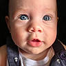 baby, blue_eyes, face, infant, portrait, cute, expression, closeup, child, navy_outfit, anchor_pattern, skin, small_nose, mouth_open, eyelashes, cheeks, person, young, adorable, indoor