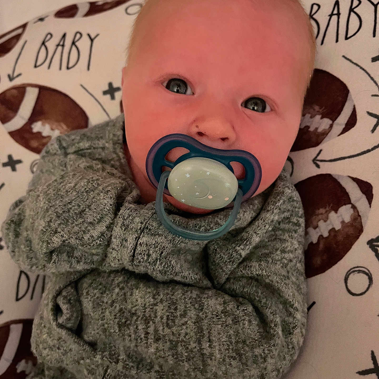 Miles joined the competition — help win amazing prizes! baby, bodypart, clothing, coat, couch, face, finger, furniture, hand, hat, head, jacket, knitwear, longsleeve, person, photography, portrait, sphere, sweater, sweatshirt