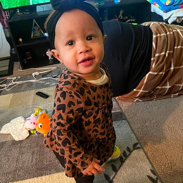 Alana joined the competition — help win amazing prizes! baby, baby_toddler_clothing, child, cloud, cool, flooring, fun, happy, home_appliance, pattern, person, play, road_surface, sidewalk, sitting, sleeve, smile, t_shirt, television, toddler