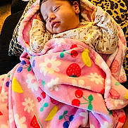Jaylianette is registered to the contest to win money with this photo: adorable, baby, blanket, closed_eyes, clothing, cozy, cushion, face, floral_pattern, fruit_pattern, indoors, infant, leopard_print, newborn, peaceful, photography, pink_blanket, portrait, resting, sleeping