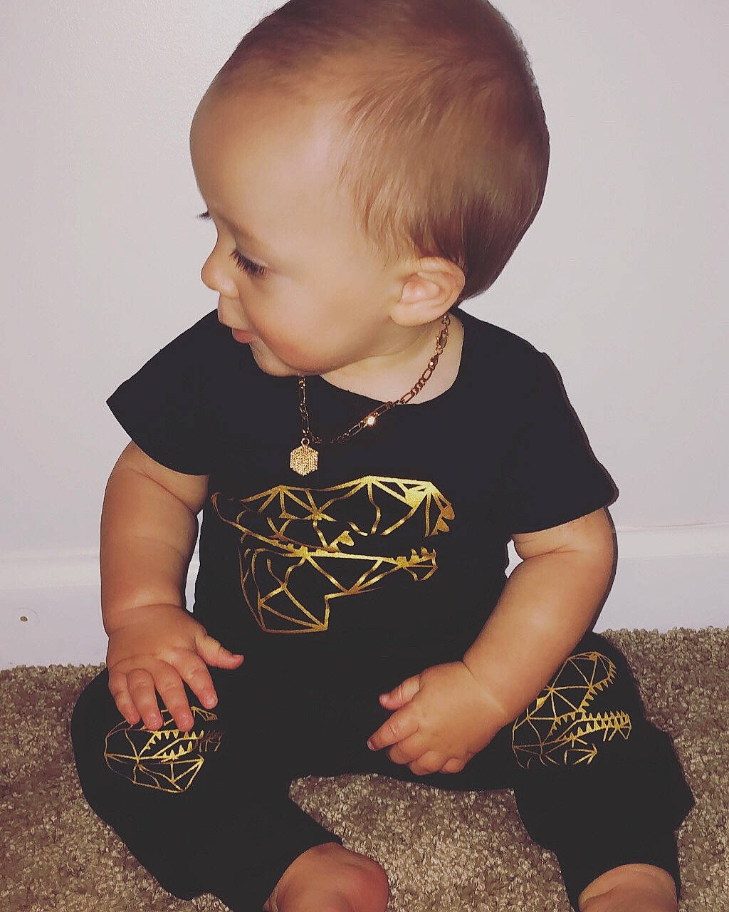 Holland is registered to the contest to win money with this photo: baby, baby_toddler_clothing, cheek, child, cool, ear, person, photography, play, sitting, skin, sleeve, t_shirt, toddler, top