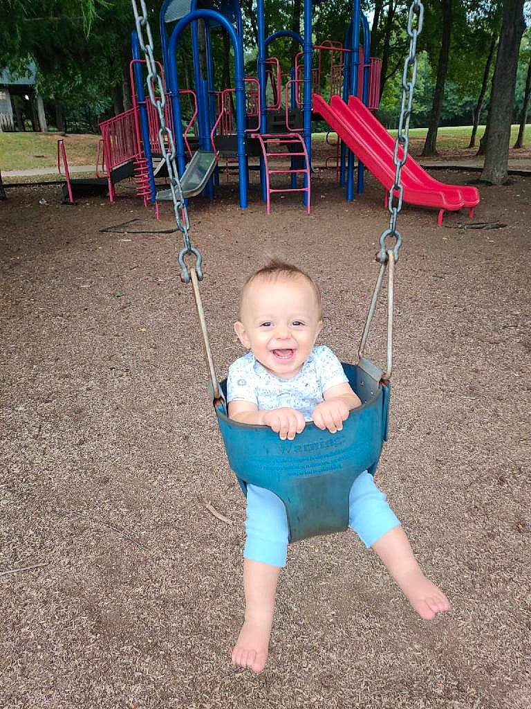 Holland joined the competition — help win amazing prizes! child, city, fun, human_settlement, joy, leisure, outdoor_play_equipment, person, play, playground, public_space, recreation, smile, swing, toddler, vacation