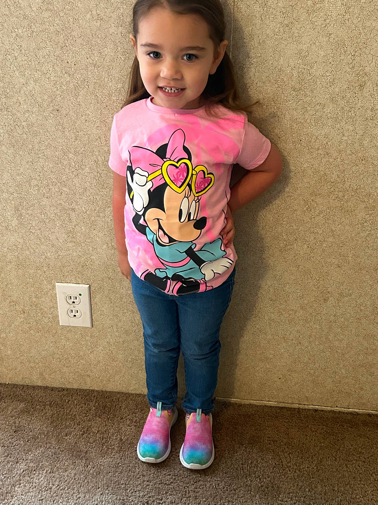 Scarlett is registered to the contest to win money with this photo: applique, child, clothing, face, female, footwear, girl, head, jeans, longsleeve, pants, pattern, person, photography, portrait, shoe, sleeve, sneaker, standing, t_shirt