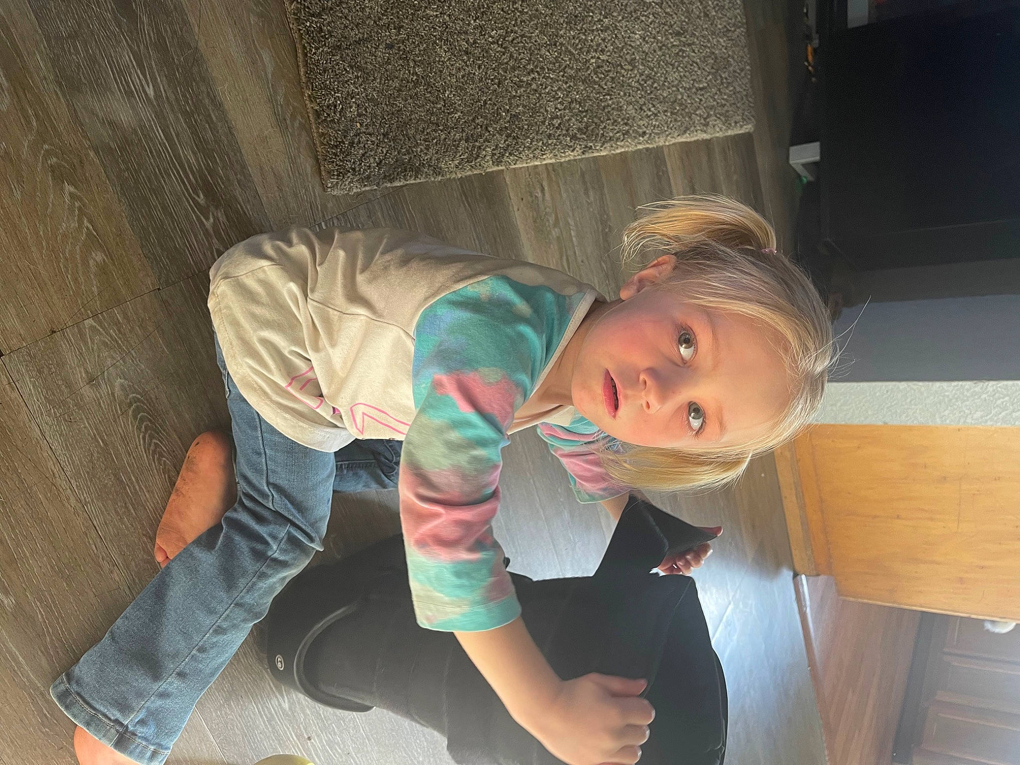 Brookelynn is registered to the contest to win money with this photo: baby, baby_products, baby_toddler_clothing, chair, cheek, child, comfort, elbow, flooring, foot, fun, happy, hardwood, human_leg, leg, person, room, sitting, sock, toddler