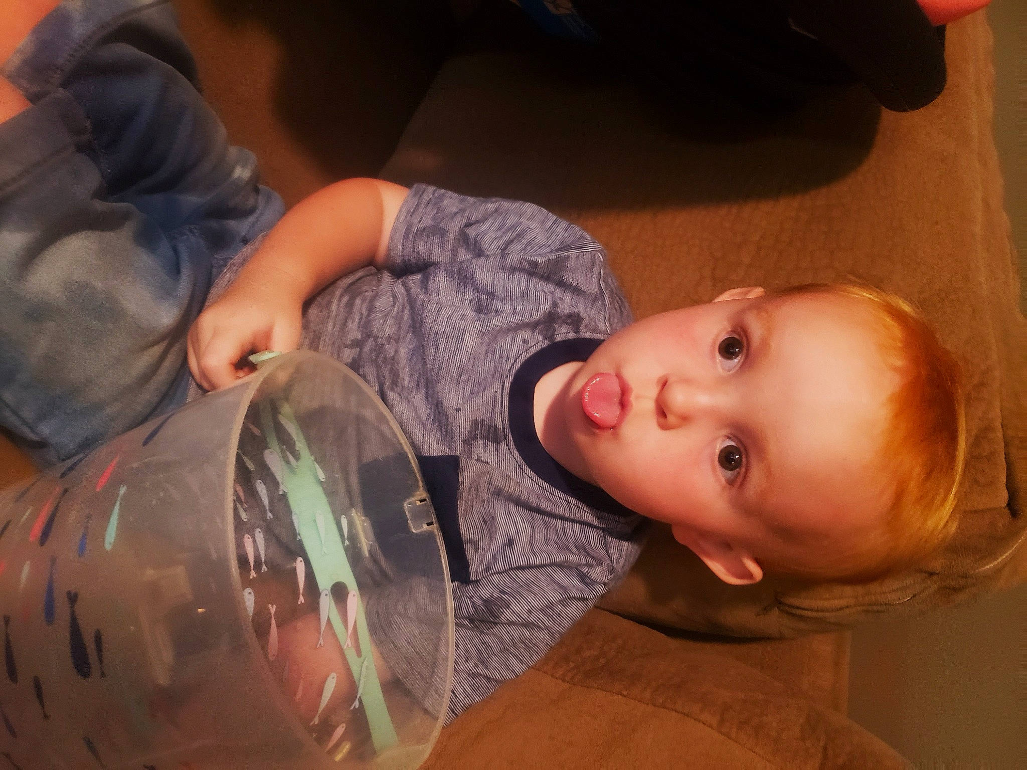 Dirrant is registered to the contest to win money with this photo: baby, cheek, child, comfort, drinkware, eyelash, finger, fun, hairstyle, happy, headgear, iris, mammal, mouth, nose, person, plastic_bottle, sitting, surprise, toddler