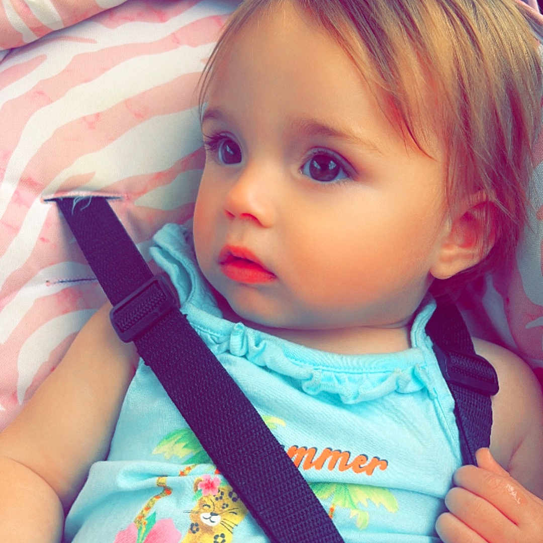 Charley is registered to the contest to win money with this photo: accessories, baby, bed, belt, bodypart, clothing, cosmetics, cushion, face, finger, furniture, hand, head, homedecor, lipstick, person, photography, portrait, strap, t_shirt