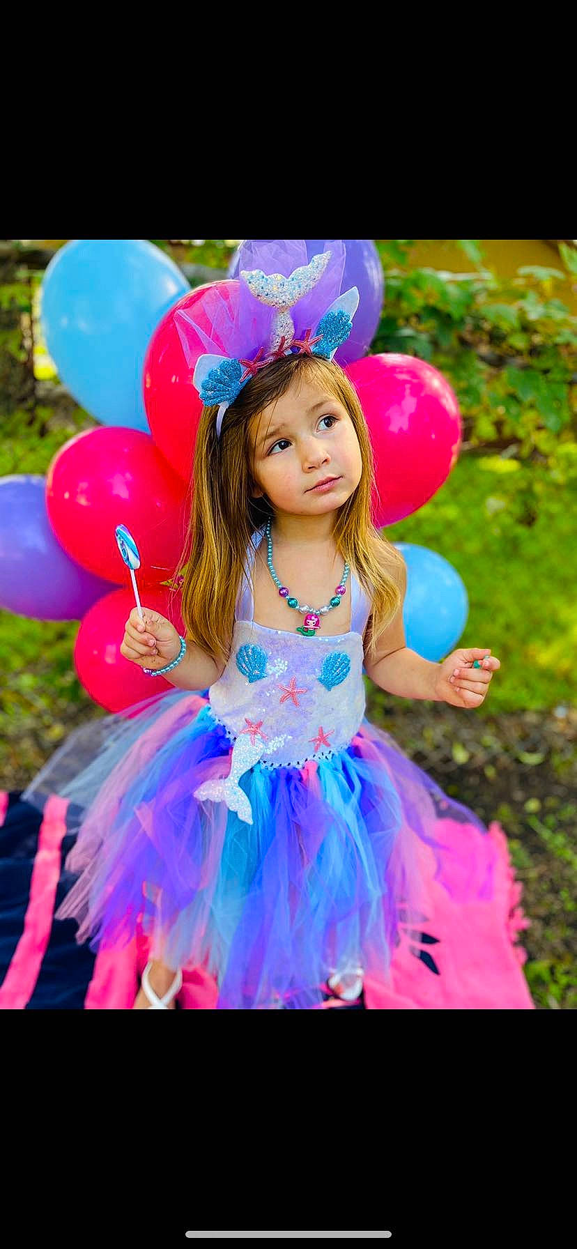 Kristiann joined the competition — help win amazing prizes! azure, balloon, beauty, child, dress, electric_blue, entertainment, event, fashion_accessory, fun, happy, headpiece, long_hair, magenta, mythical_creature, party_supply, person, petal, pink, purple