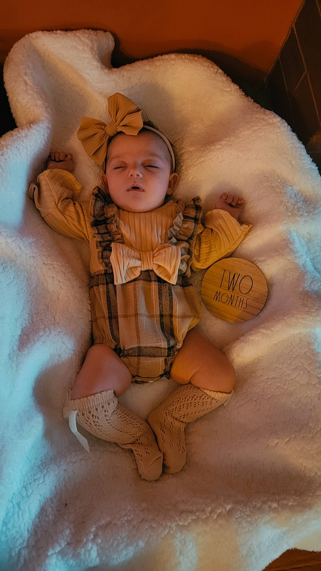 Braelyn joined the competition — help win amazing prizes! baby, baby_sleeping, baby_toddler_clothing, bed, child, comfort, fashion_accessory, fawn, finger, flooring, fun, fur, linens, pattern, peach, person, sitting, skin, thigh, toddler