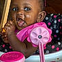 Samariah is registered to the contest to win money with this photo: baby, bodypart, clothing, cream, cutlery, dessert, face, food, furniture, happy, head, icecream, icing, mouth, person, photography, portrait, smile, spoon, t_shirt