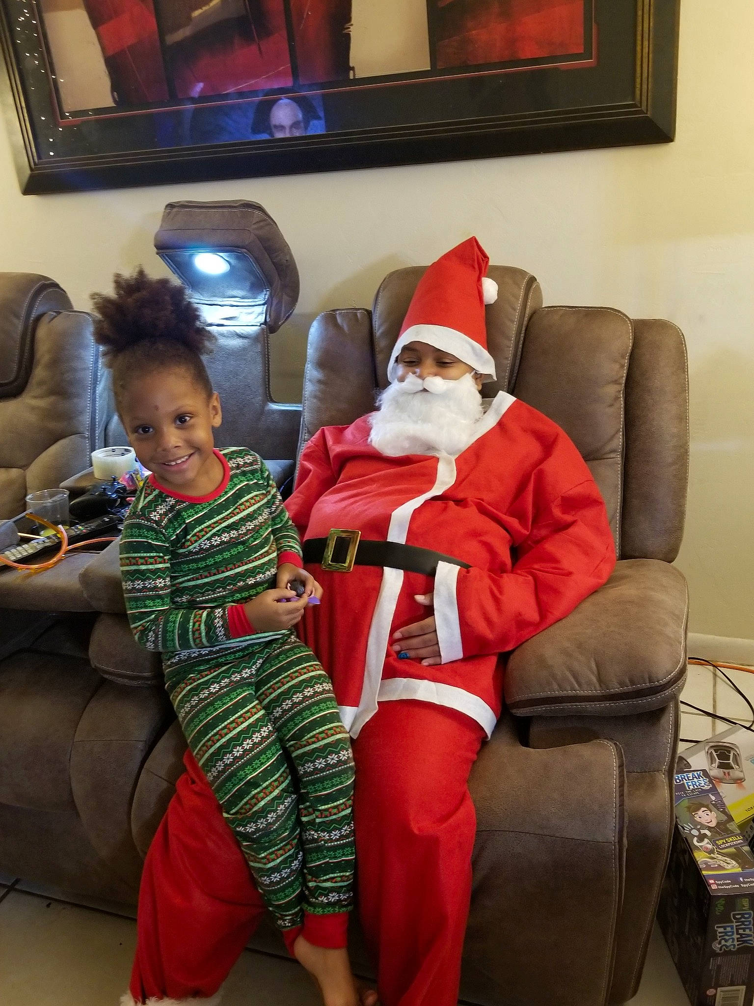 Kaitlyn is registered to the contest to win money with this photo: christmas, event, fictional_character, fun, holiday, joy, lap, person, santa_claus