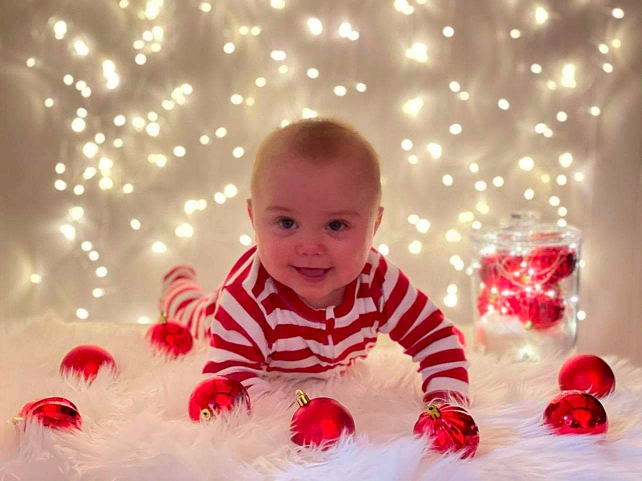Tanner is registered to the contest to win money with this photo: baby, baby_laughing, baby_playing_with_toys, baby_products, baby_toddler_clothing, baby_toys, carmine, child, christmas, crawling, facial_expression, fun, happy, holiday, joy, person, play, pleased, portrait_photography, red