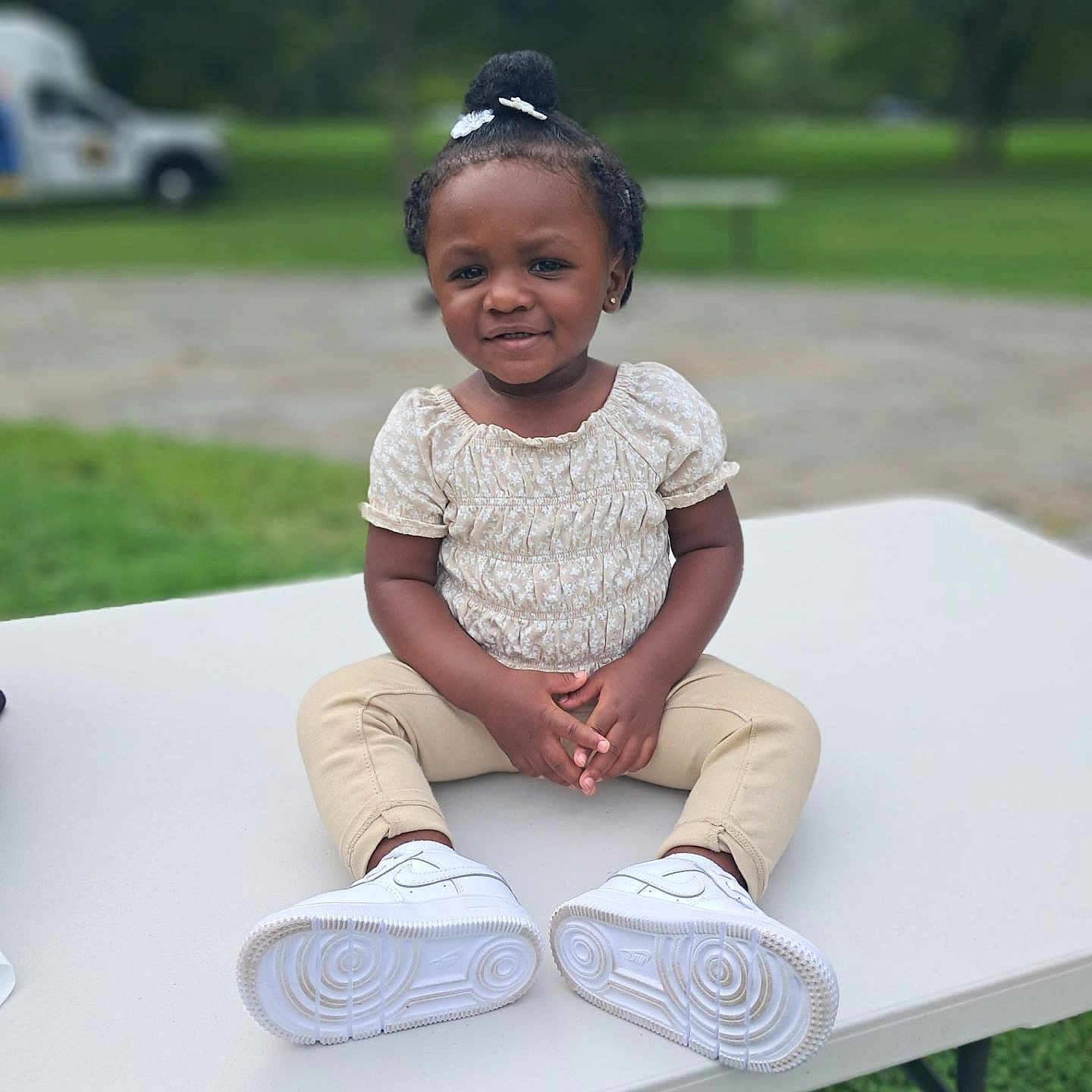 Za'Karri joined the competition — help win amazing prizes! child, clothing, face, female, footwear, furniture, girl, grass, head, nature, outdoors, pants, park, person, photography, plant, portrait, shoe, sitting, table