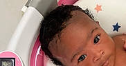 Kehlani is registered to the contest to win money with this photo: baby, bath_time, bathtub, calm, child, close_up, curly_hair, cute, digital_thermometer, eyes, face, home, infant, looking_at_camera, pink, relaxing, skin, stars, water, white