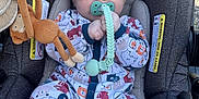 Malachi is registered to the contest to win money with this photo: baby, infant, sunglasses, pacifier, car_seat, toy_monkey, blanket, onesie, animal_pattern, clip, headrest, safety_label, plush_toy, cute, sitting, outdoor_light, infant_clothing, stroller, hand, portrait