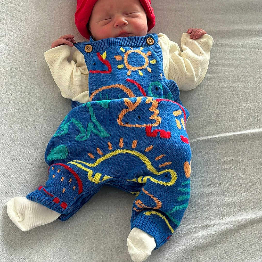 Jenson joined the competition — help win amazing prizes! baby, cap, clothing, cushion, face, glove, hat, head, hockey, homedecor, icehockey, icehockeypuck, newborn, person, photography, portrait, rink, skating, sleeping, sport