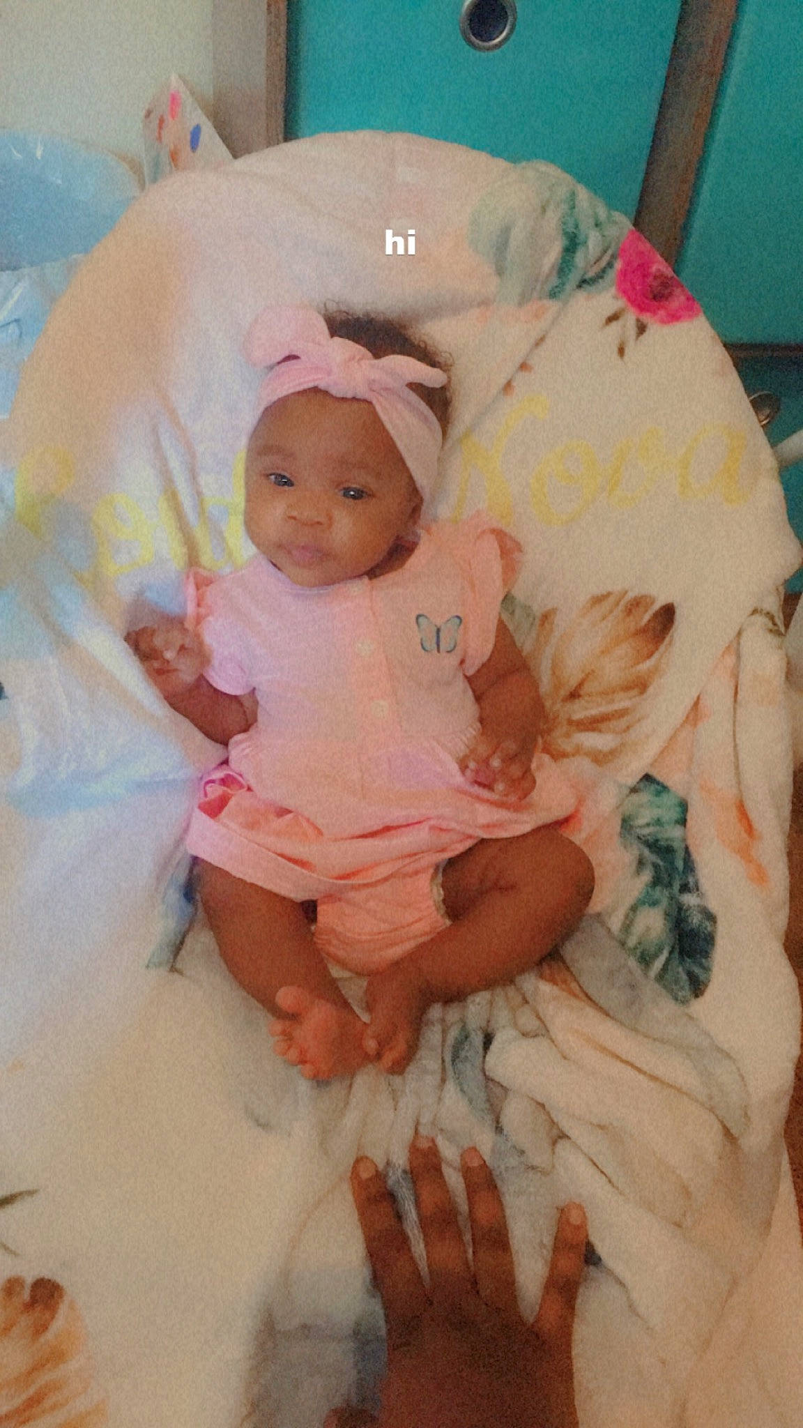 London joined the competition — help win amazing prizes! arm, baby, baby_toddler_clothing, cheek, child, comfort, eye, finger, foot, happy, hat, headwear, human_body, iris, linens, peach, person, pink, sitting, skin