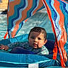 baby, pool, float, water, child, swimming, sunshade, colorful, blue, orange, waves, wet_hair, summer, outdoor, infant, splash, play, sunlight, relax, swimwear