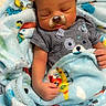 baby, infant, sleeping, portrait, dog_filter, digital_effect, blanket, striped_shirt, onesie, bed, indoors, cozy, cute, closed_eyes, face, hands, textile, colorful, resting, child