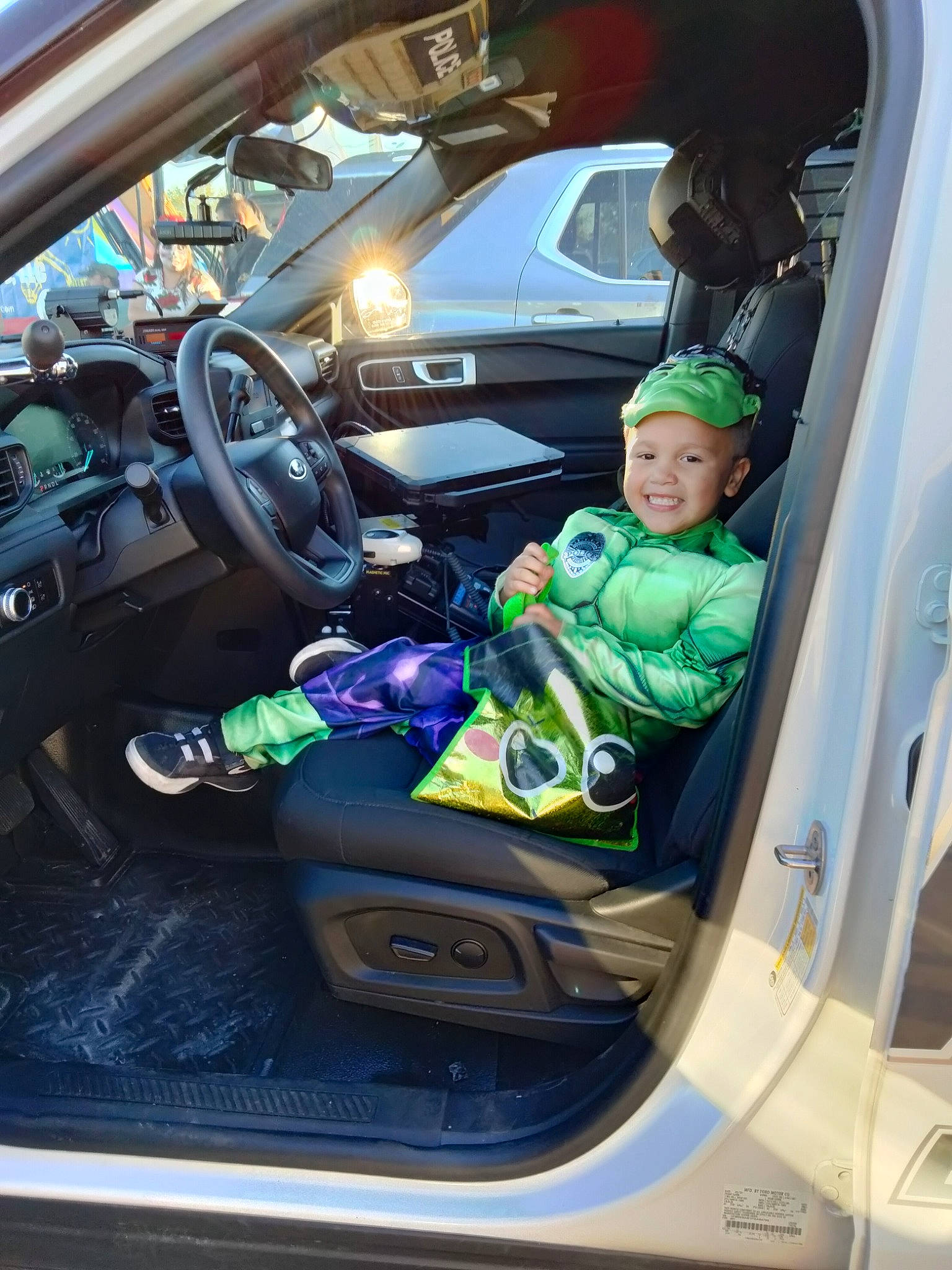 Mauricio is registered to the contest to win money with this photo: auto_part, automotive_design, automotive_exterior, automotive_mirror, automotive_wheel_system, automotive_window_part, car, car_seat, car_seat_cover, headwear, joy, mode_of_transport, motor_vehicle, person, personal_luxury_car, plant, rear_view_mirror, smile, steering_wheel, toddler