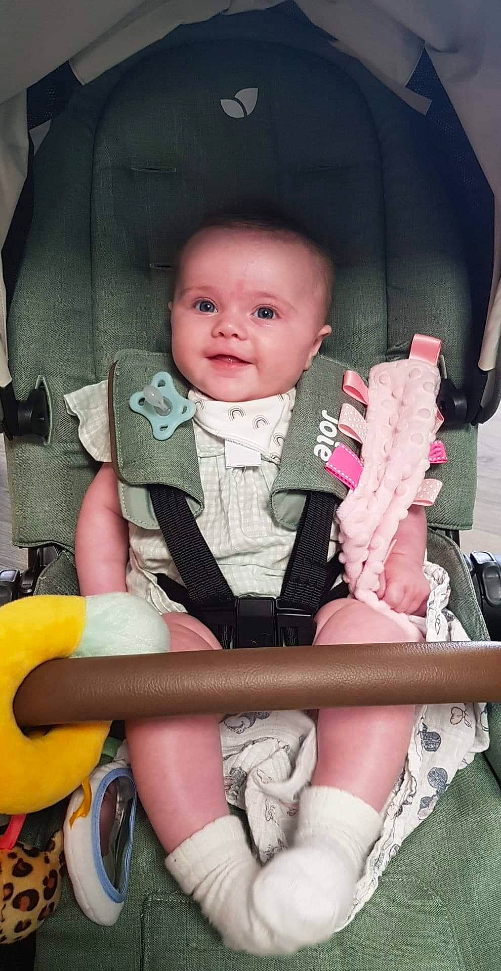 Maeve joined the competition — help win amazing prizes! baby, baby_toddler_clothing, cheek, child, comfort, eye, facial_expression, finger, hairstyle, lap, people, person, pink, sitting, skin, sleeve, smile, sock, thigh, toddler