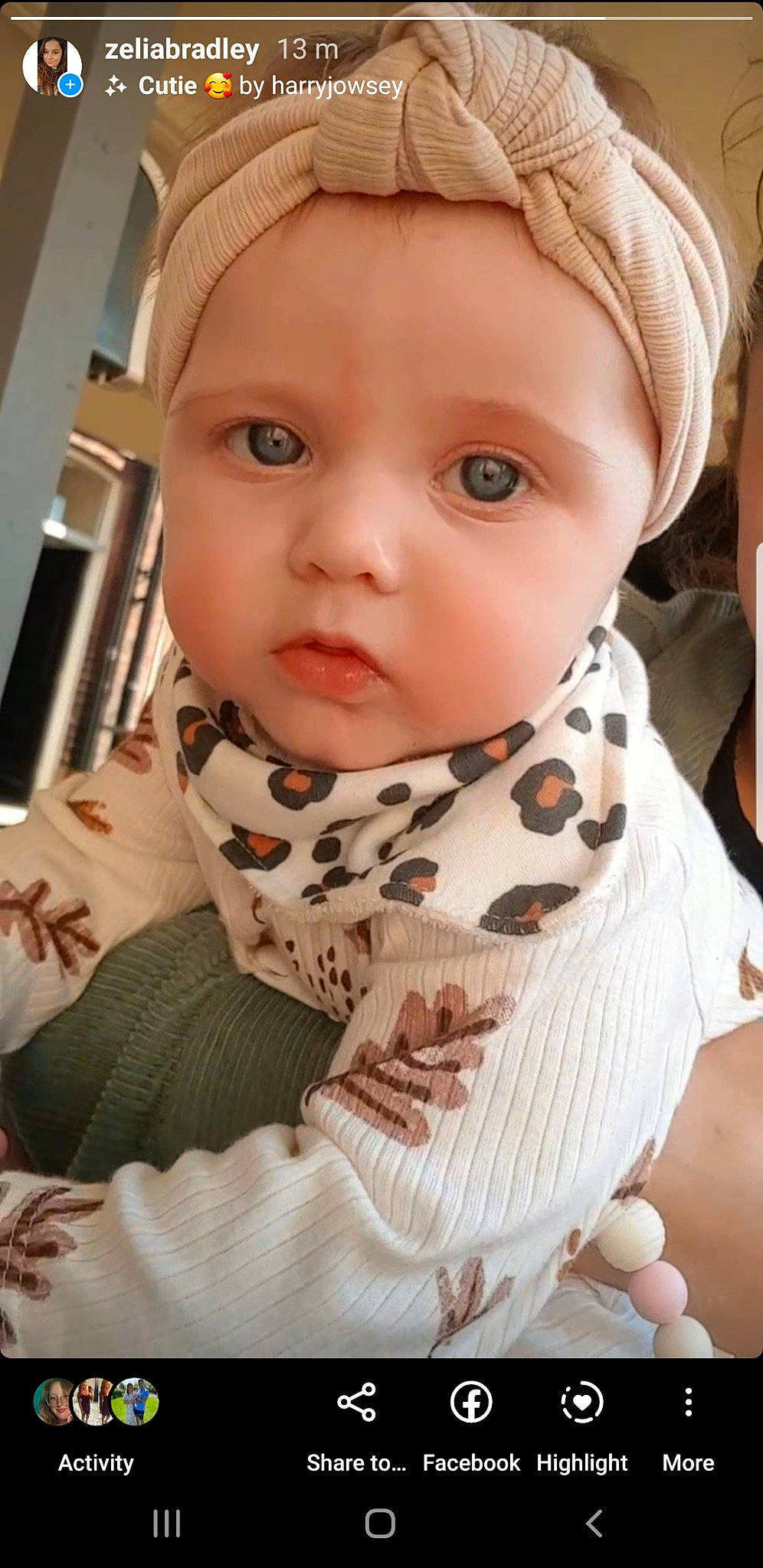 Maeve is registered to the contest to win money with this photo: baby, baby_toddler_clothing, cap, cheek, collar, eyelash, fashion_accessory, human_body, iris, joy, lip, neck, outerwear, pattern, person, scarf, shawl, skin, sleeve, stole