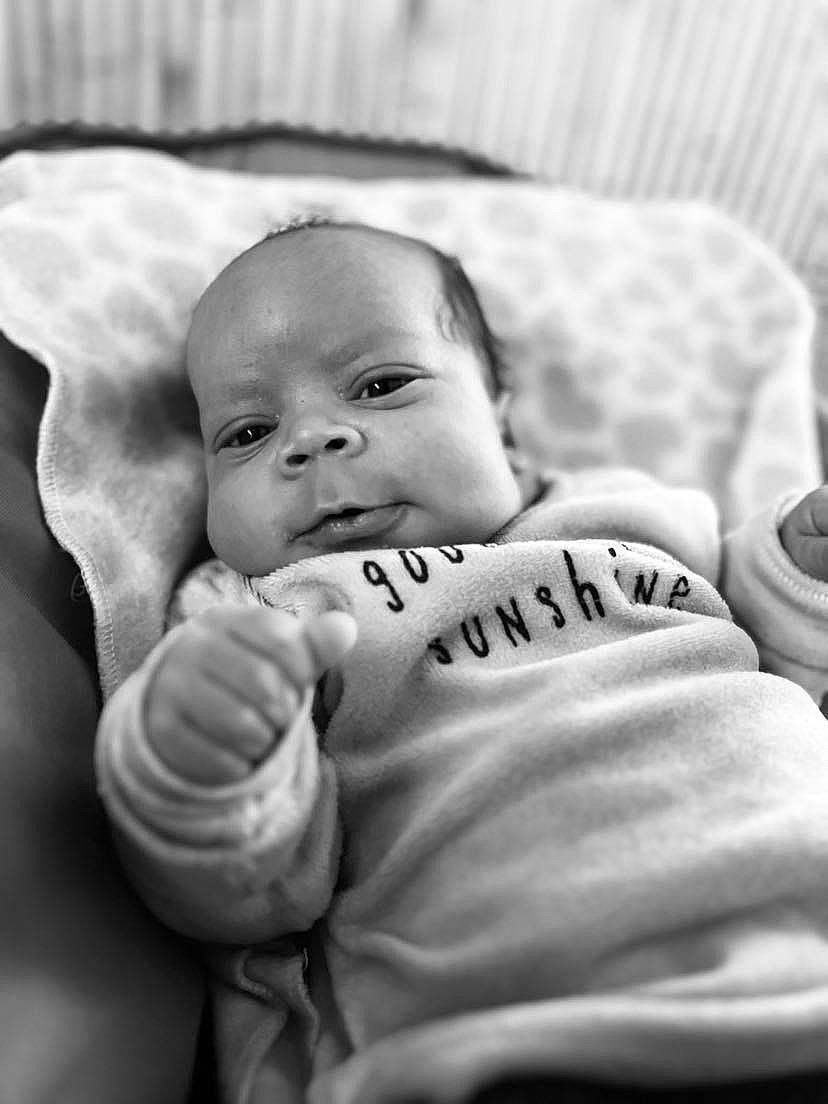 Kingsley participe au concours pour gagner de l'argent avec cette photo : baby, black_and_white, cheek, child, comfort, eye, facial_expression, flash_photography, gesture, grey, happy, head, linens, monochrome, monochrome_photography, person, sitting, smile, style, thumb