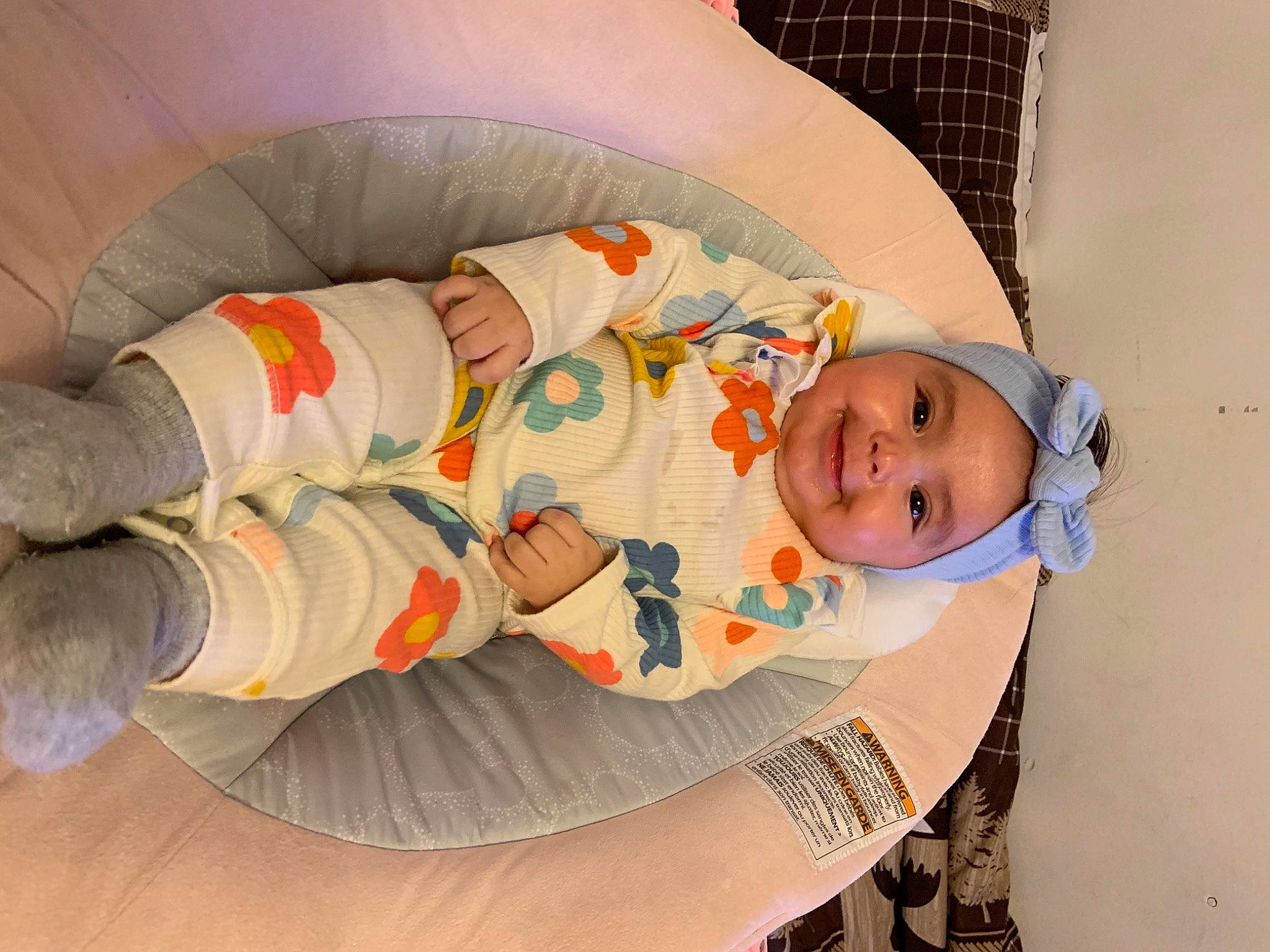Anahi joined the competition — help win amazing prizes! baby, baby_products, baby_safety, baby_sleeping, baby_toddler_clothing, child, comfort, headgear, headwear, human_body, joy, linens, nap, orange, pattern, person, room, sitting, sleep, sleeve