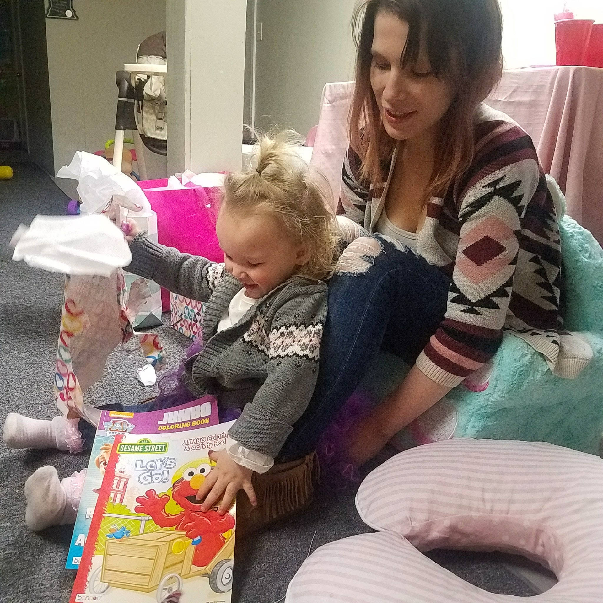 Annaliyah is registered to the contest to win money with this photo: baby, child, daughter, joy, lap, mother, person, play, toddler, toy