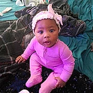 A'Myah is registered to the contest to win money with this photo: baby, bed, blanket, bottle, child, cozy, curious, cute, headband, home, indoor, infant, person, pillow, pink_onesie, portrait, sitting, sleepwear, soft, young