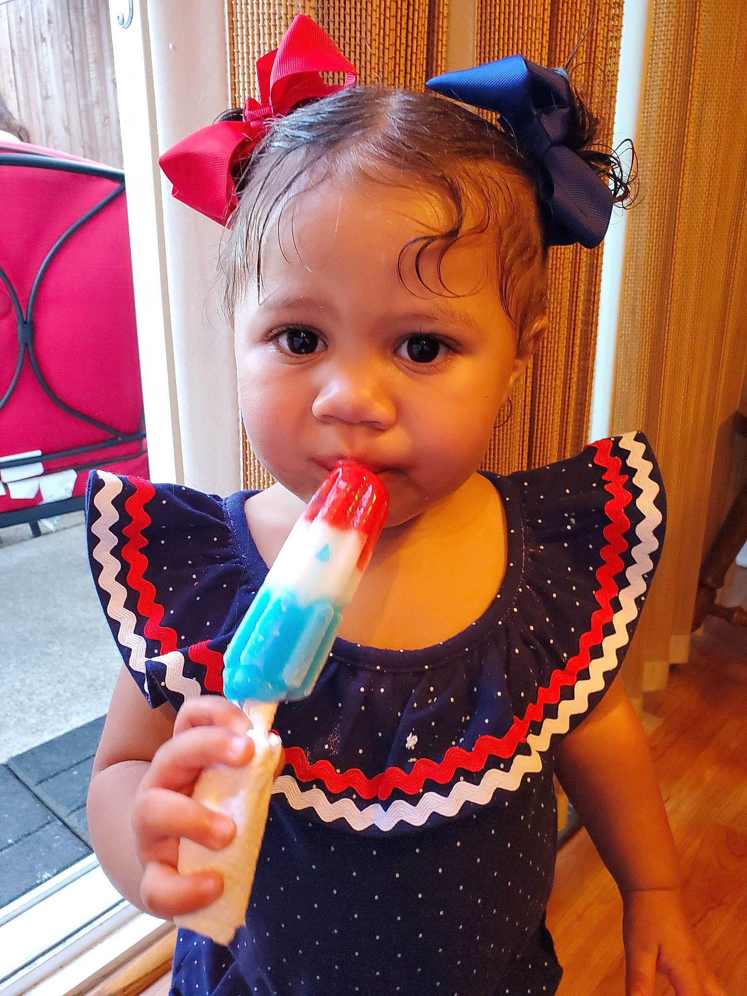 Nyla is registered to the contest to win money with this photo: child, musical_instrument, party_supply, pattern, person, polka_dot, toddler