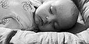 Jenna participe au concours pour gagner de l'argent avec cette photo : baby, sleeping, face, black_and_white, pillow, soft, peaceful, infant, closeup, portrait, rest, calm, child, cushion, cute, relaxation, apparel, indoors, young, serene