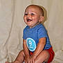 baby, child, infant, smiling, sitting, blue_shirt, red_shorts, happy, skin, legs, feet, hands, face, indoor, portrait, cute, young, nine_months, clothing, background