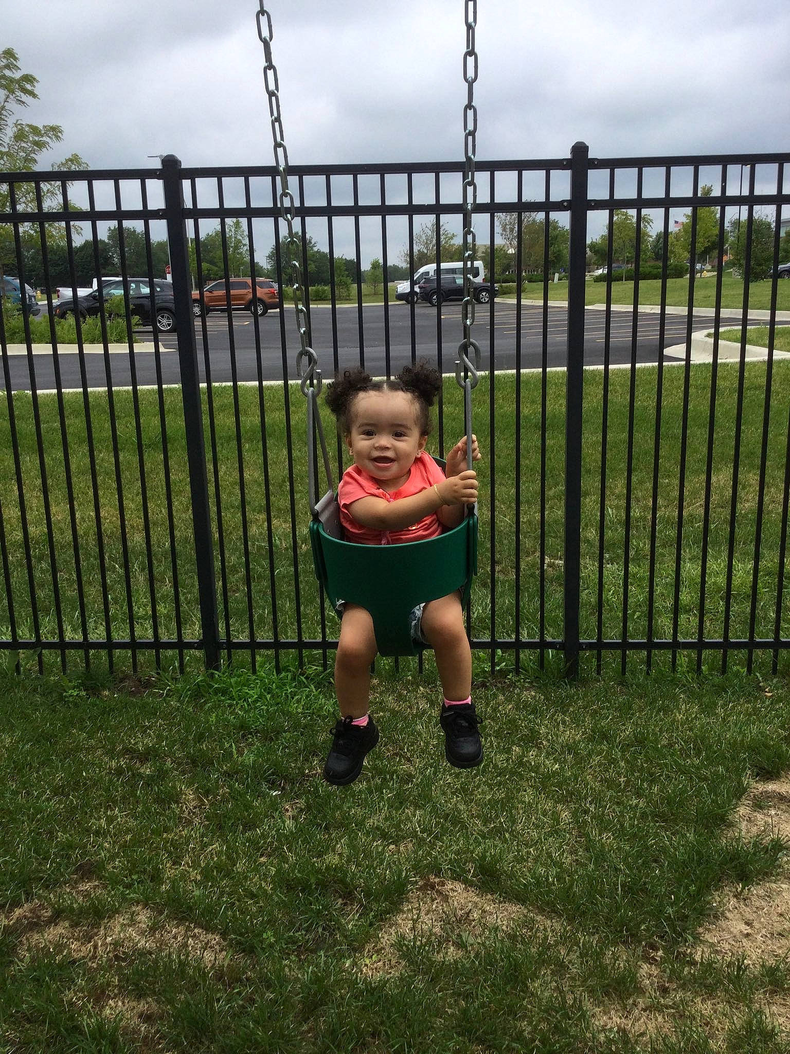 Mylani joined the competition — help win amazing prizes! baby, cloud, fence, grass, grassland, home_fencing, landscape, lawn, leisure, mesh, people_in_nature, person, plant, recreation, shorts, sky, swing, toddler, tree, vertebrate