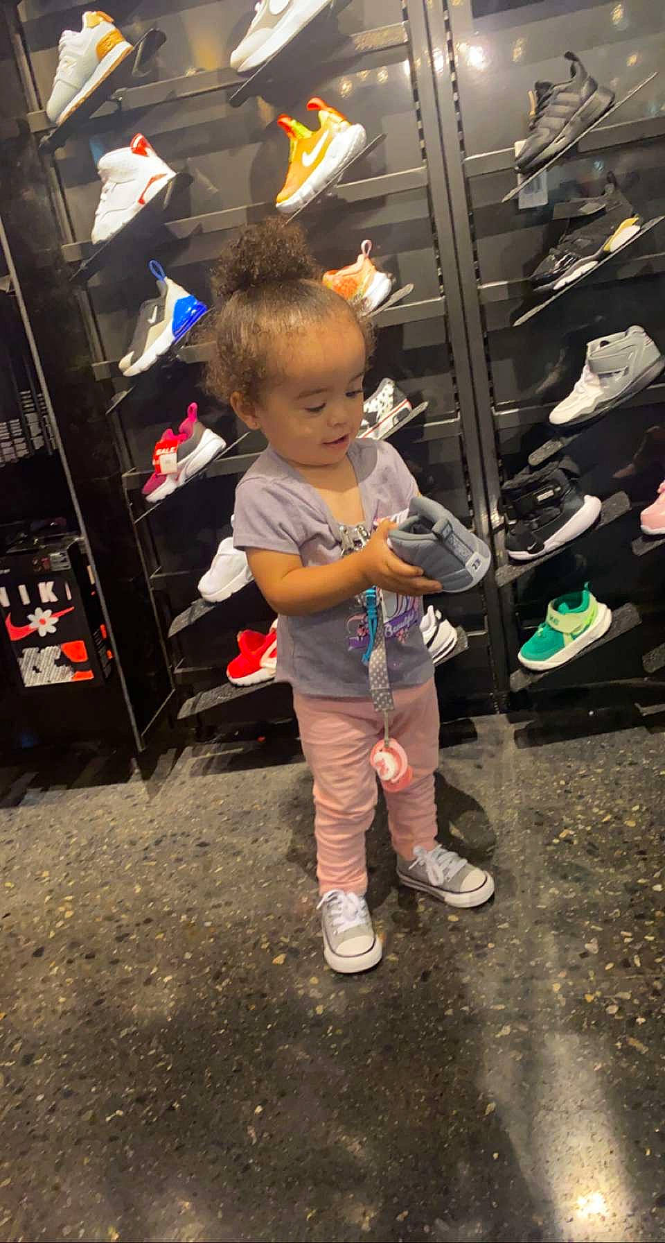 Mylani is registered to the contest to win money with this photo: child, city, event, fun, leisure, pedestrian, person, road, room, sandal, shoe, sneakers, street, t_shirt, toddler, travel