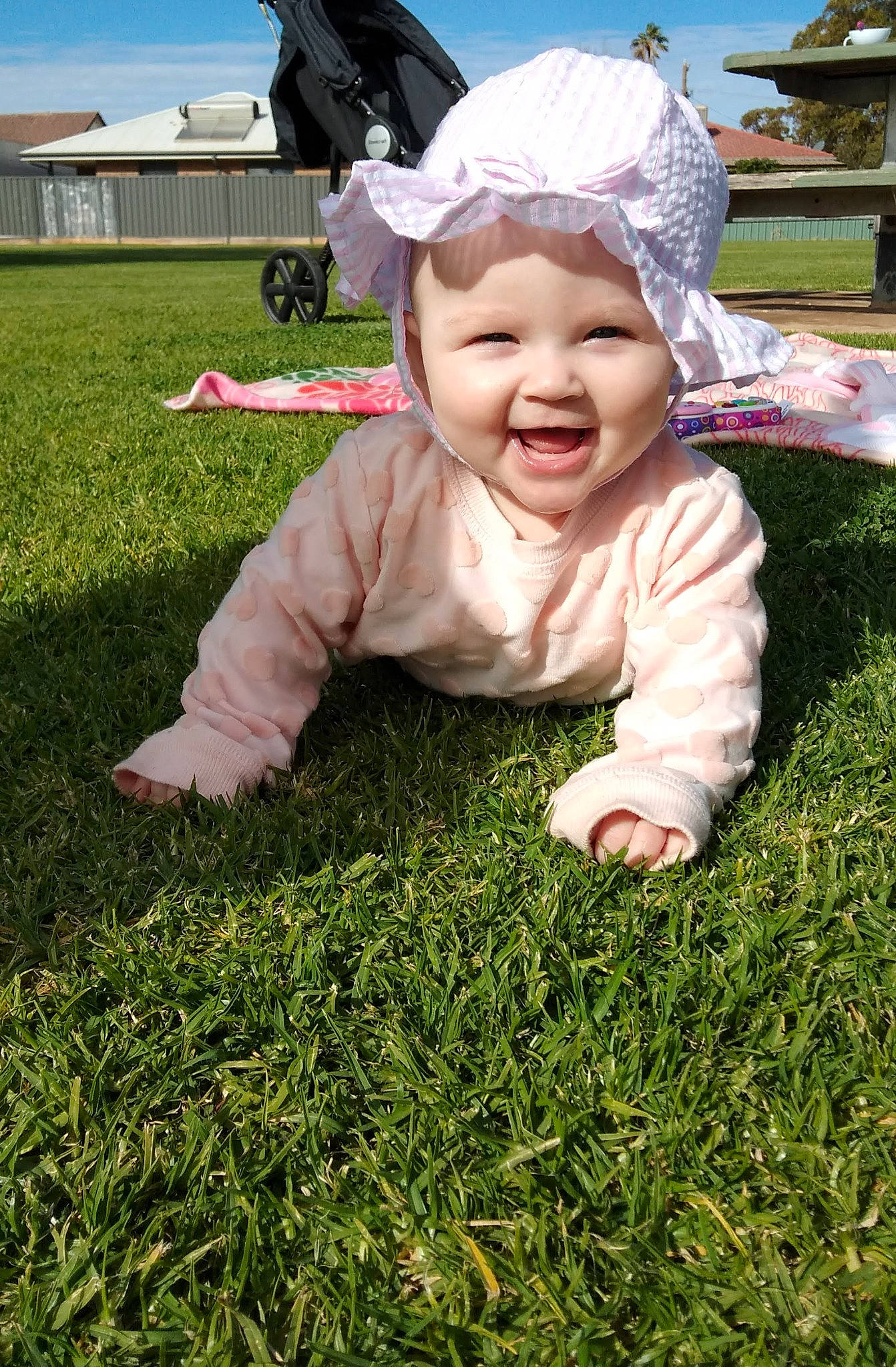 Brylee is registered to the contest to win money with this photo: baby, child, facial_expression, fun, garden, grass, green, happy, head, headwear, joy, lawn, leaf, meadow, person, plant, play, skin, smile, toddler