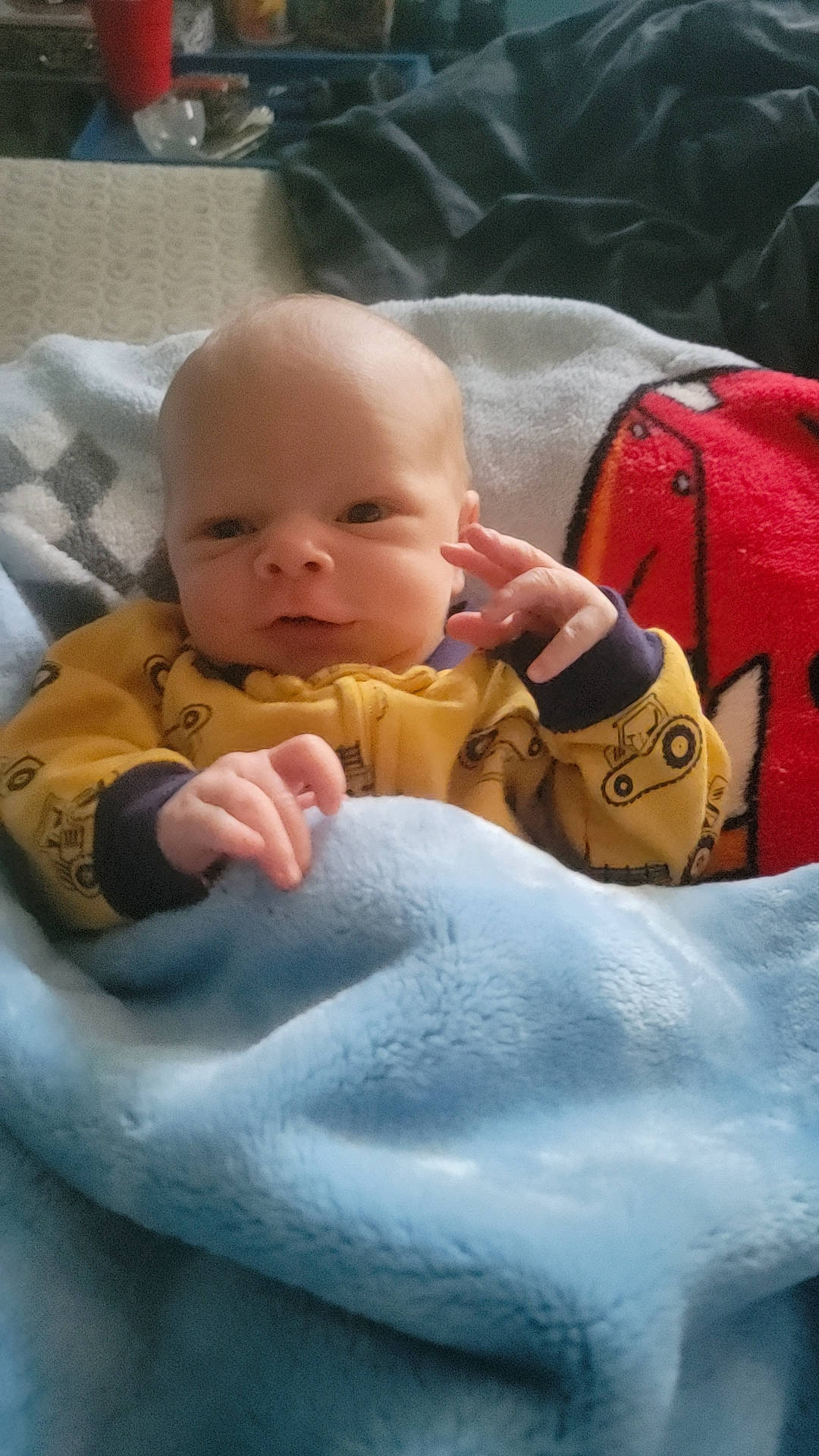 Liam joined the competition — help win amazing prizes! baby, baby_products, baby_toddler_clothing, bag, beauty, cheek, child, comfort, eye, gesture, grass, human, linens, luggage_and_bags, mouth, person, sitting, skin, textile, thumb