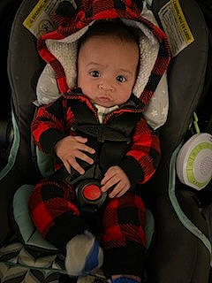 Kai joined the competition — help win amazing prizes! baby, baby_carriage, baby_products, baby_toddler_clothing, carmine, cheek, child, comfort, eye, face, fun, head, lap, person, plaid, product, sitting, sleeve, tartan, toddler