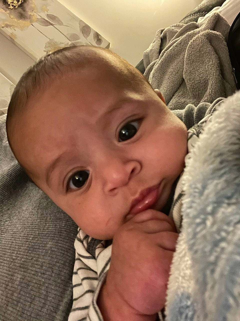 Kai is registered to the contest to win money with this photo: baby, baby_toddler_clothing, cheek, child, comfort, ear, eyebrow, eyelash, finger, fur, gesture, happy, lip, nail, nose, organ, person, skin, thumb, toddler