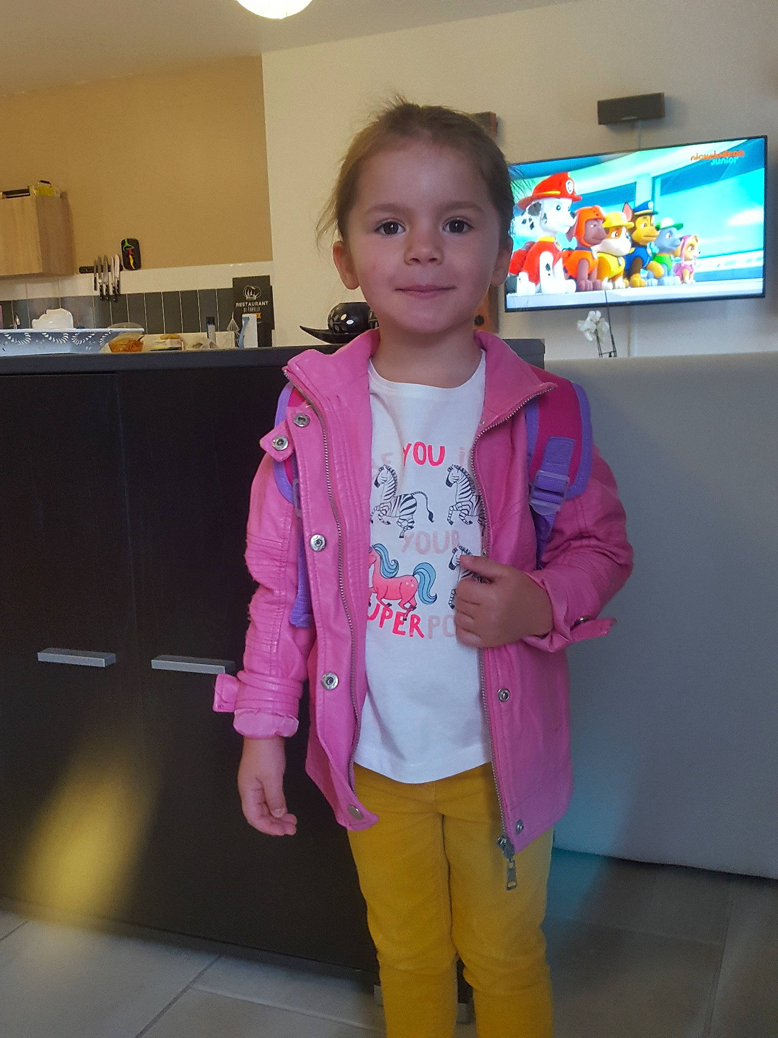 Victoire a rejoint le concours — aidez-le/la à gagner de superbes lots ! blazer, child, clothing, day, fashion, fun, girl, jeans, magenta, outerwear, person, pink, product, purple, shoulder, smile, snapshot, standing, textile, toddler