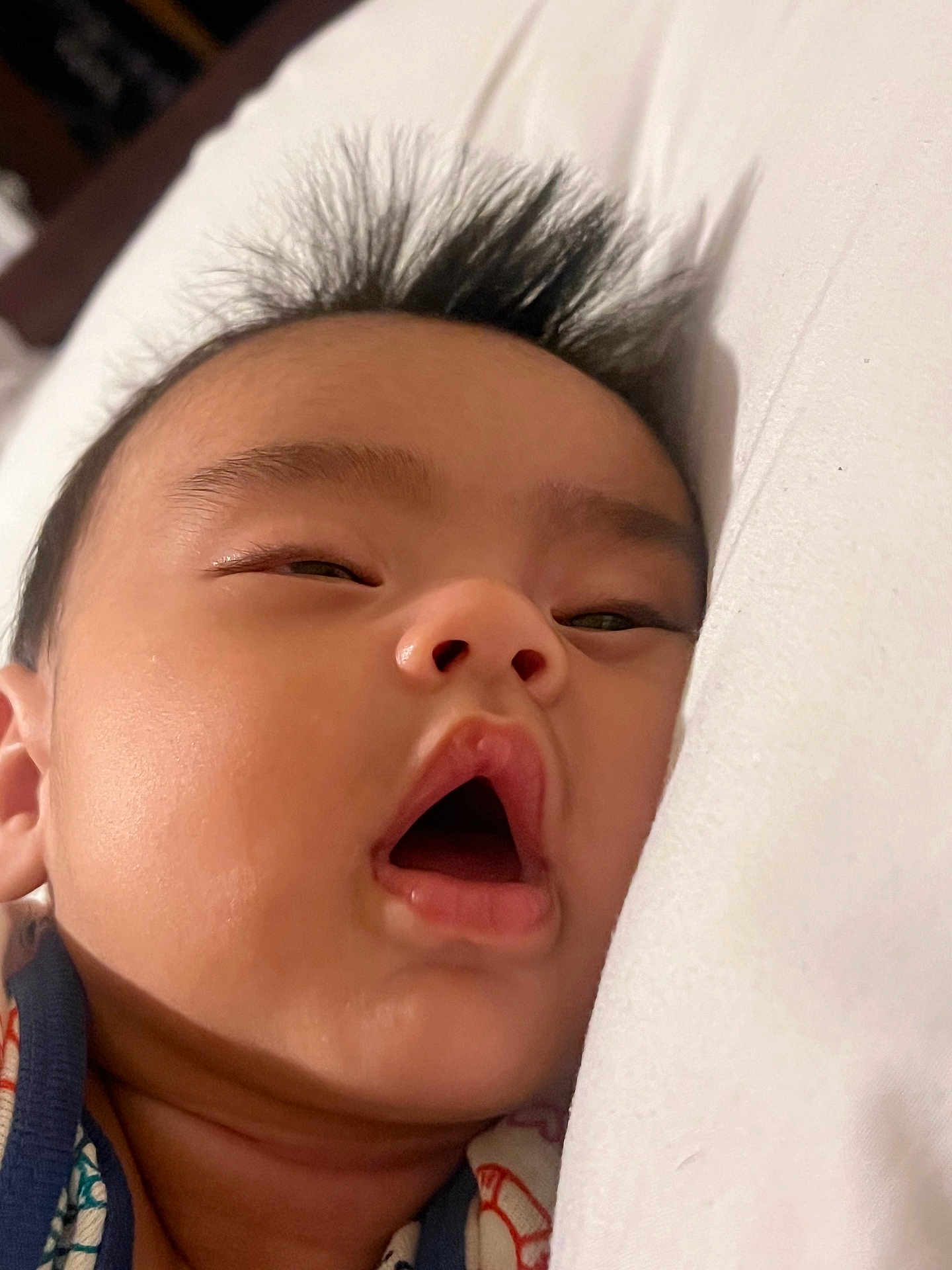 Julian joined the competition — help win amazing prizes! baby, face, close_up, sleepy, pillow, mouth_open, hair, infant, skin, expression, lying_down, child, adorable, indoors, cute, young, portrait, one_person, head, resting
