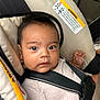 Julian joined the competition — help win amazing prizes! baby, child, car_seat, safety, straps, infant, person, seatbelt, closeup, portrait, indoors, warning_label, young_child, cute, face, head, clothing, hands, seat, car