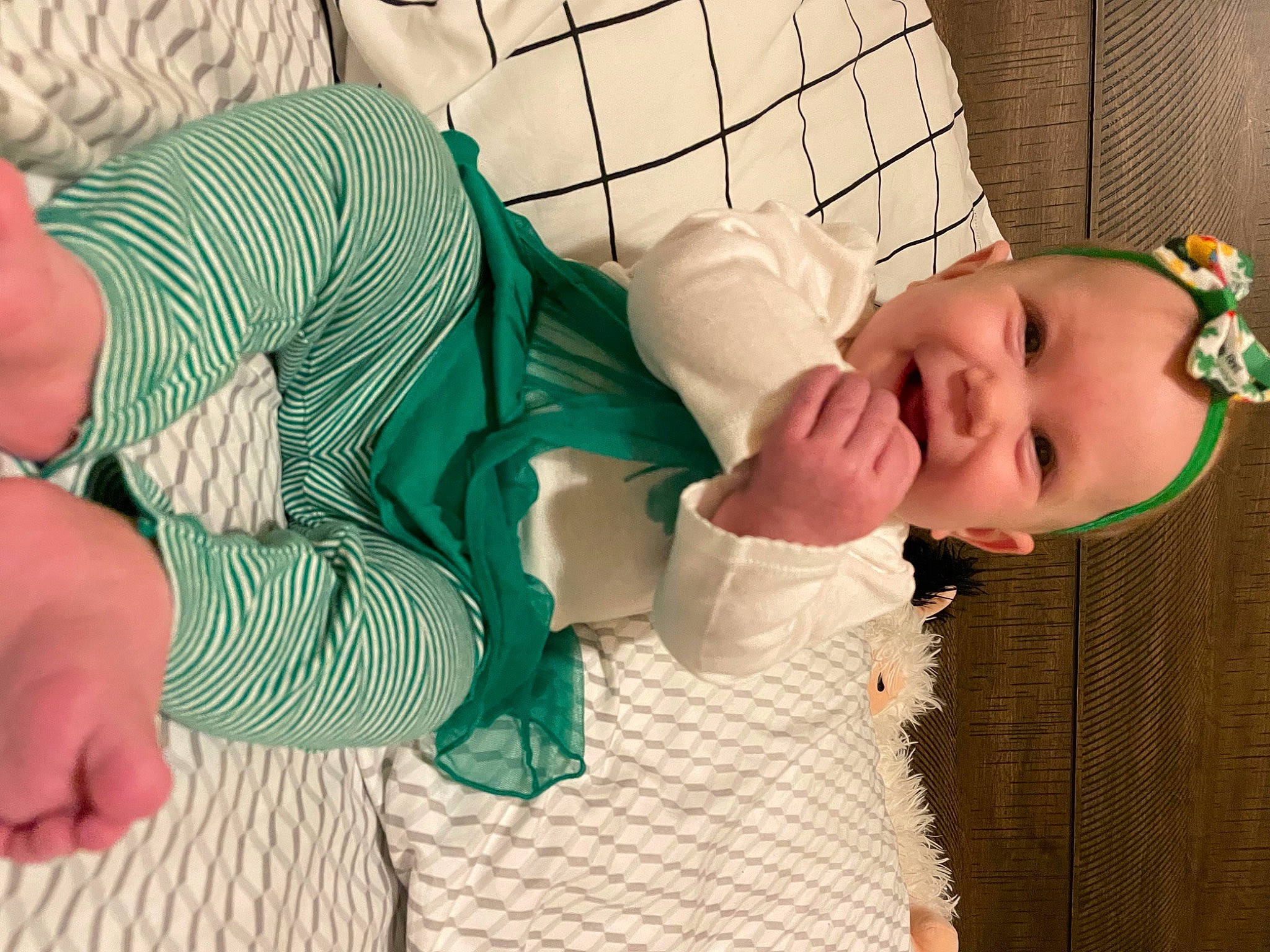 Aubree is registered to the contest to win money with this photo: arm, baby, baby_toddler_clothing, child, comfort, eye, face, finger, green, happy, head, human_body, joint, mouth, nose, person, skin, sleeve, smile, textile