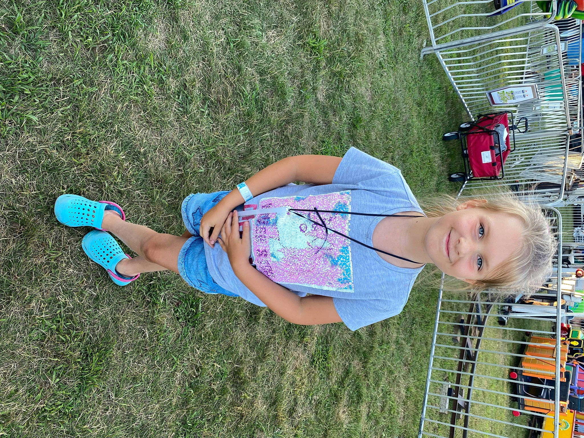 Eliza is registered to the contest to win money with this photo: child, electric_blue, fun, grass, grassland, happy, human_leg, joy, leisure, people_in_nature, person, play, recreation, shorts, smile, t_shirt, thigh, toddler, vacation