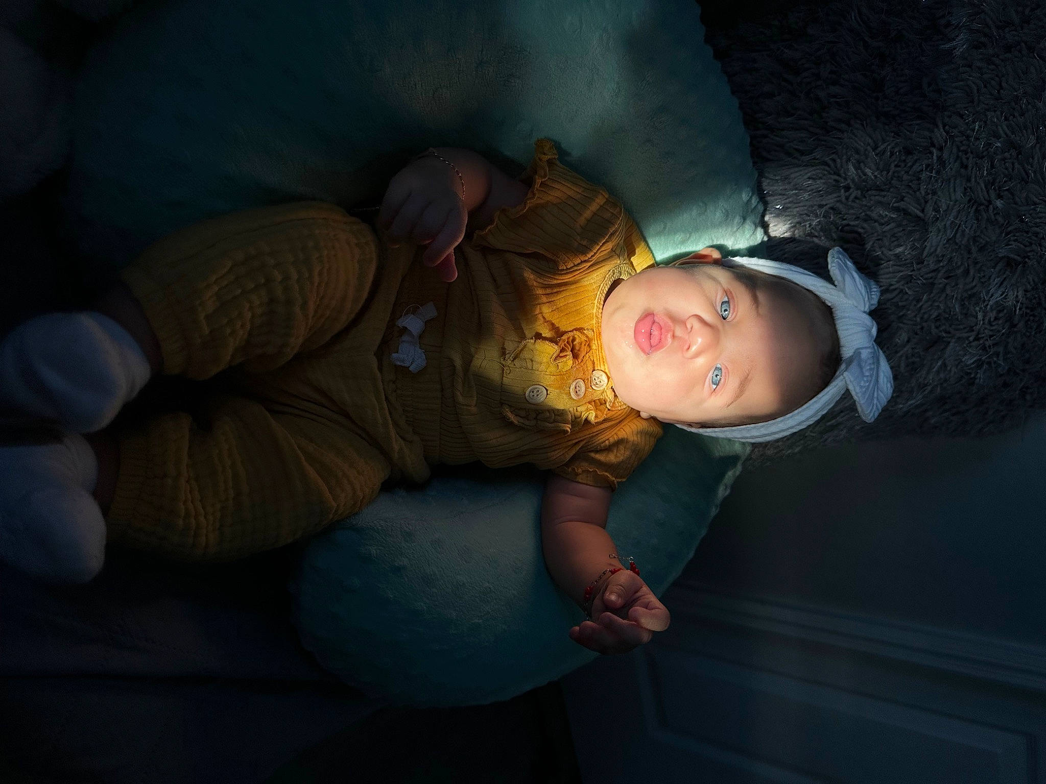 Kataleya is registered to the contest to win money with this photo: baby, cheek, child, comfort, darkness, flash_photography, fun, headgear, headwear, human_leg, midnight, nap, person, room, sitting, skin, space, thigh, tints_and_shades, toddler
