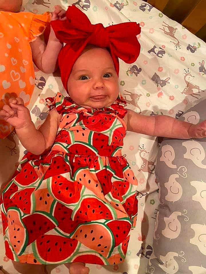 Ruby is registered to the contest to win money with this photo: baby, baby_products, baby_toddler_clothing, child, headwear, pattern, person, product, red, sleeve, textile, toddler