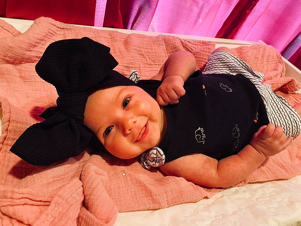 Ruby joined the competition — help win amazing prizes! baby, baby_products, beanie, black_hair, bonnet, cap, cheek, child, ear, fashion_accessory, hair_accessory, happy, hat, headgear, headwear, joy, person, photography, pink, product